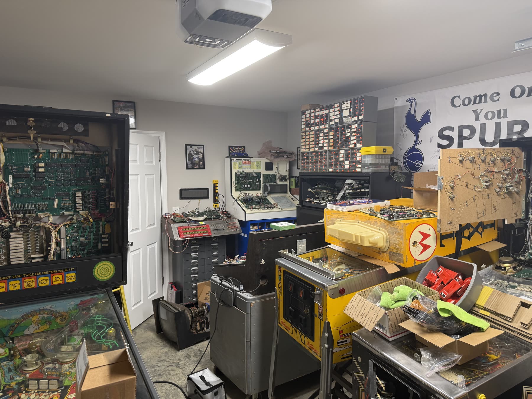 Pinball machines and test benches inside the Carolina Pinball Repair shop