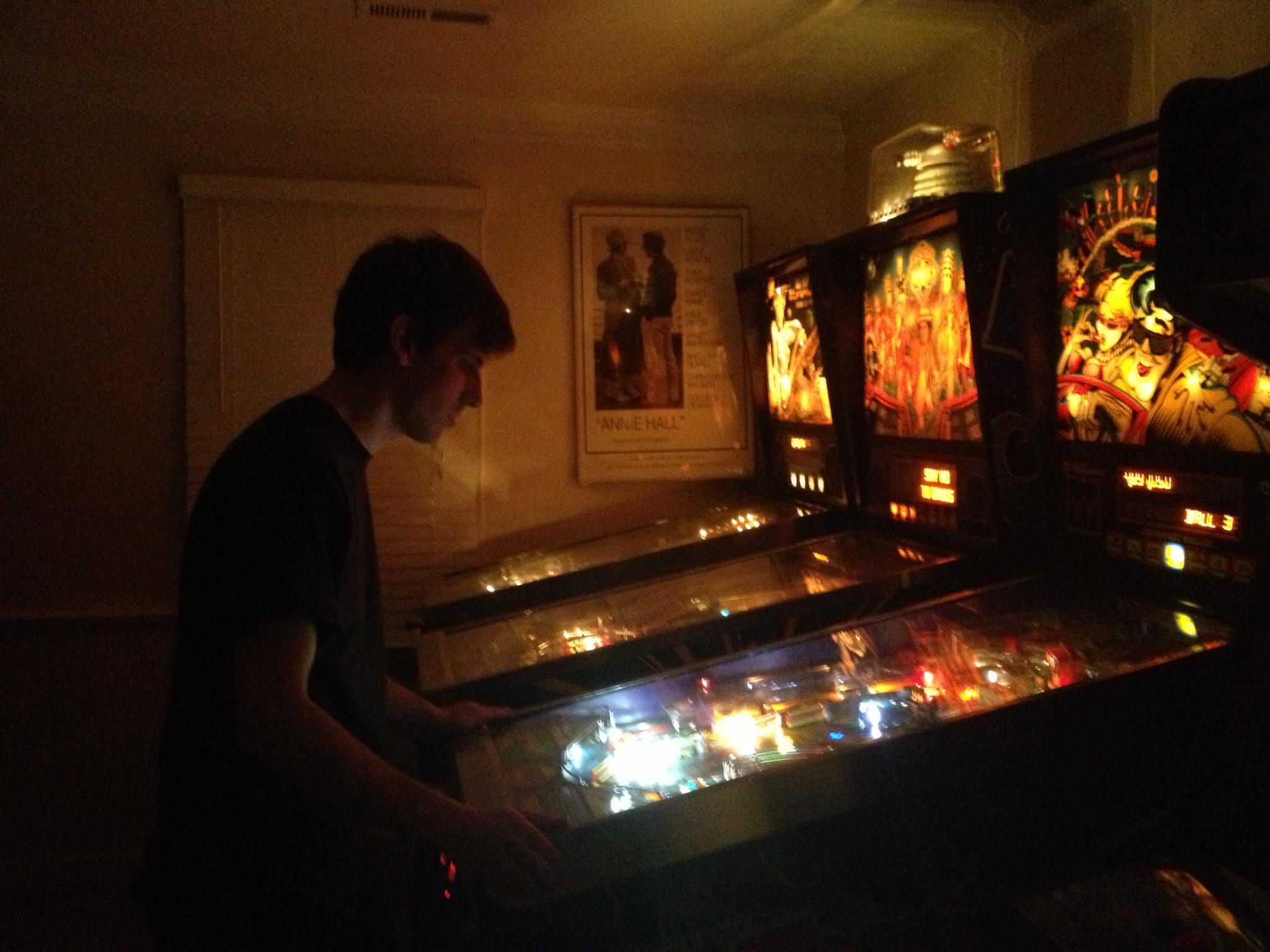 Matthew Mandarano with a pinball machine